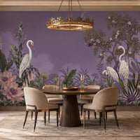 Beautifully decorated dining room features a large, dusty lavender wall mural depicting an elegant tropical jungle scene with white herons, purple flowers, lush green foliage, and butterflies.