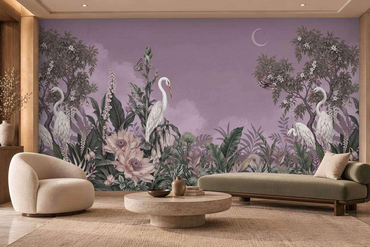 Whimsical mural featuring white herons amidst lush tropical flora dominates the back wall of a modern, neutral-toned living room. The mural displays a muted purple backdrop with a crescent moon, detailed green foliage, pale ivory blossoms, and tall trees.