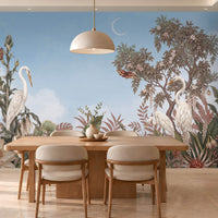 An illustrated, botanical landscape mural featuring three white egrets amidst lush tropical foliage under a sky blue, sky.