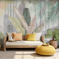 An architectural perspective of a contemporary, sunlit living room featuring the Sublime Botanical Mural  in Misty Sage as a full-scale feature wall. The mural’s muted taupe and mushroom hues pair elegantly with a curved cream sofa, minimalist stone side tables, and light oak flooring, creating a serene and sophisticated interior sanctuary.