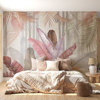 An architectural perspective of a contemporary, sunlit living room featuring the Sublime Botanical Mural as a full-scale feature wall. The mural’s soft pink and rose hues pair elegantly with a curved cream sofa, minimalist stone side tables, and light oak flooring, creating a serene and sophisticated interior sanctuary.