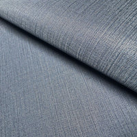 Close-up view of Waterproof Fabric Backed Commercial Wallcovering in Soft Steel Blue, showcasing a dense, industrial textile texture with a fine linear-weave pattern and a muted metallic blue and gray finish on a durable vinyl surface.