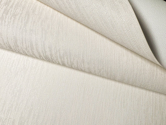 Close-up view of Waterproof Fabric Backed Commercial Wallcovering in Ivory Amber, featuring a delicate rippled silk texture with a warm, golden-cream luster on a durable vinyl surface.