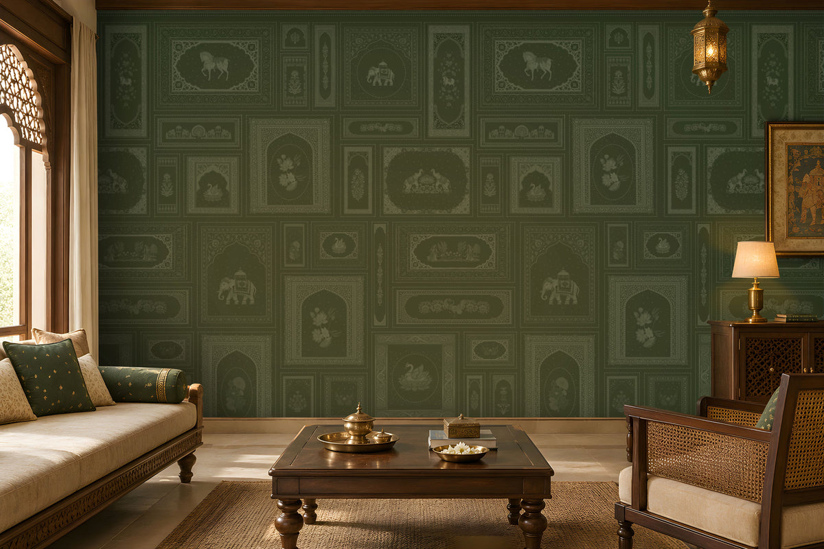 The Royal Rajputana Courtyard wallpaper in Heritage Moss Green featuring intricate Rajasthani palace-inspired motifs, elephant illustrations, floral panels, Mughal arches, and antique detailing in a luxurious traditional living room.
