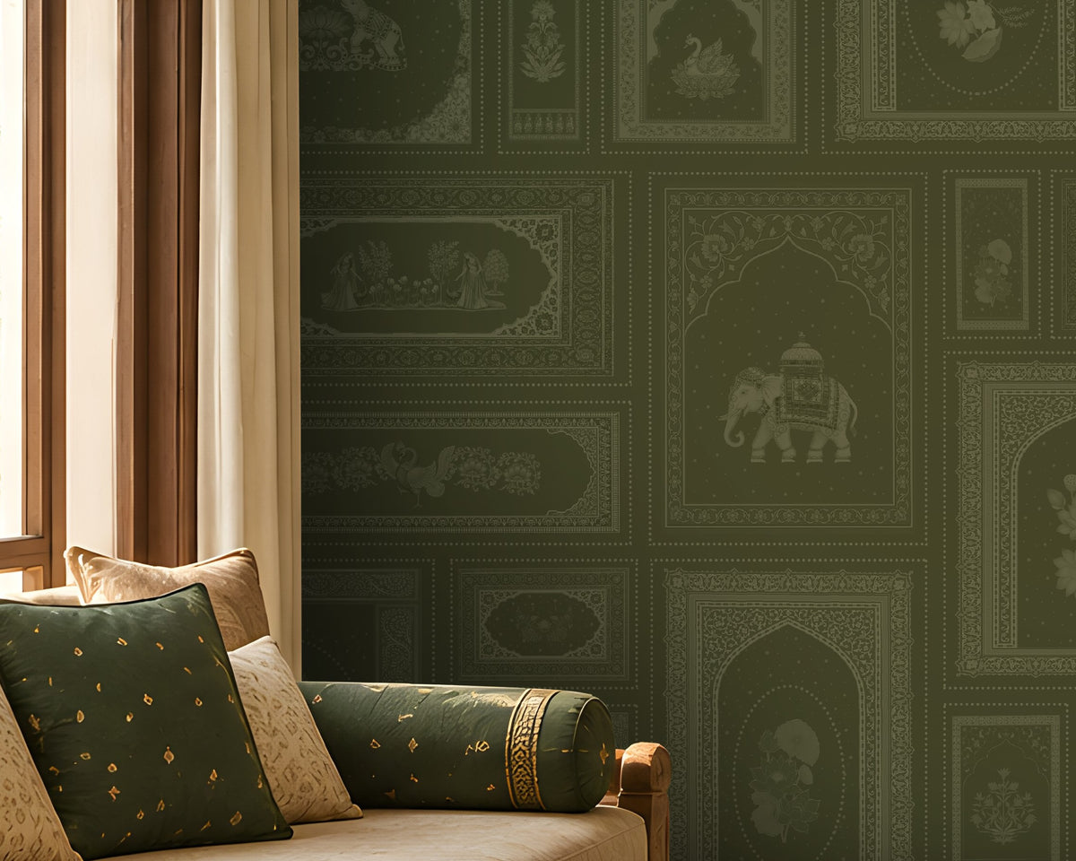 The Royal Rajputana Courtyard wallpaper in Heritage Moss Green featuring intricate Rajasthani palace-inspired motifs, elephant illustrations, floral panels, Mughal arches, and antique detailing in a luxurious traditional living room.
