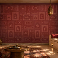 The Royal Rajputana Courtyard wallpaper in Heritage Ruby Red featuring intricate Rajasthani palace-inspired motifs, elephant illustrations, floral artwork, Mughal arches, and tonal heritage patterns in a luxurious royal-inspired interior.