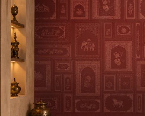 The Royal Rajputana Courtyard wallpaper in Heritage Ruby Red featuring intricate Rajasthani palace-inspired motifs, elephant illustrations, floral artwork, Mughal arches, and tonal heritage patterns in a luxurious royal-inspired interior.
