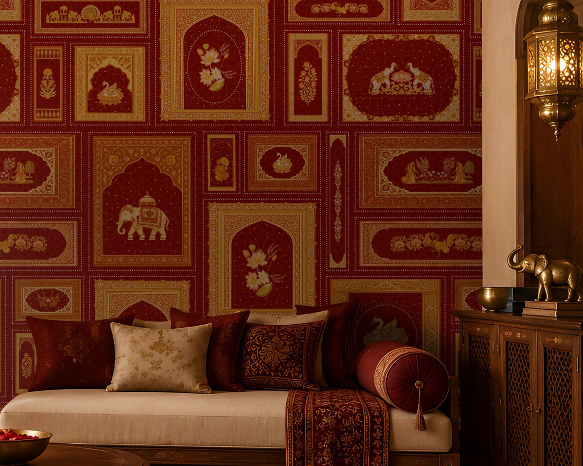 The Royal Rajputana Courtyard wallpaper in Regal Wine Red featuring intricate Rajasthani palace-inspired motifs, elephant illustrations, floral artwork, Mughal arches, and antique gold detailing in a luxurious living room setting.