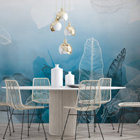 An architectural perspective of a minimalist office lounge featuring the Tropical Abstract Mural in Aqua Blue as a full-scale feature wall. The mural’s vibrant yet soothing cool tones pair strikingly with vertical wood paneling and sleek mid-century furniture, creating a peaceful and cultured interior sanctuary.