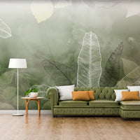 An architectural perspective of a minimalist office lounge featuring the Tropical Abstract Mural in Camouflage Green as a full-scale feature wall. The mural’s deep, earthy tones pair strikingly with vertical wood paneling and sleek mid-century furniture, creating a peaceful and cultured interior sanctuary.
