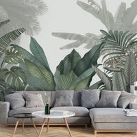 An architectural perspective of a contemporary living room featuring the Tropical Forest Mural in American Silver as a full-scale feature wall. The mural’s cool, neutral botanical composition pairs elegantly with modern chrome accents and white marble flooring, creating a peaceful and sophisticated interior sanctuary.