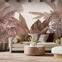 An architectural perspective of a contemporary living room featuring the Tropical Forest Mural in New York Pink as a full-scale feature wall. The mural’s warm botanical composition pairs elegantly with velvet furniture and brass accents, creating a chic and sophisticated interior sanctuary.