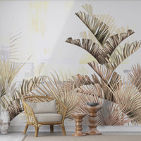 An architectural perspective of a bright, modern dining area featuring the Tropical Fusion Mural in Parchment White as a full-scale feature wall. The mural’s neutral, sophisticated tones complement minimalist black metal furniture and natural stone flooring, transforming the space into a contemporary tropical oasis.