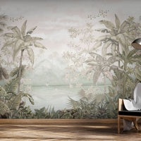 An architectural perspective of a contemporary lounge featuring the Tropical Island Oasis Mural in Artichoke Green as a full-scale feature wall. The mural’s balanced, panoramic composition pairs elegantly with natural rattan furniture and linen textiles, creating a peaceful and cultured interior sanctuary.