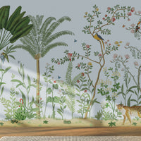 An architectural perspective of a sophisticated hallway featuring the Tropical Jungle Haven Mural as a full-scale feature wall. The mural’s detailed wildlife narrative pairs elegantly with light wood furniture and natural sunlight, creating a grand and cultured interior sanctuary.