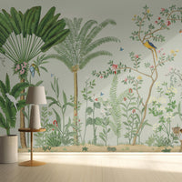 An architectural perspective of a sophisticated master suite featuring the Tropical Jungle Haven Mural in Lichen Green as a full-scale feature wall. The mural’s detailed wildlife narrative pairs elegantly with light-toned oak furniture and neutral linens, creating a peaceful and cultured interior sanctuary.