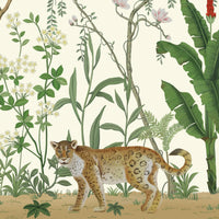 An architectural perspective of a sophisticated lounge featuring the Tropical Jungle Haven Mural in Sandy Beige as a full-scale feature wall. The mural’s detailed wildlife narrative pairs elegantly with warm wood tones and gold accents, creating a grand and sun-drenched interior sanctuary.