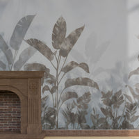 A high-resolution detail of the Silver Mist Tropical Wallpaper, showcasing the layered, semi-translucent textures of the large tropical leaves. The image highlights the painterly, watercolor-style gradients and the sophisticated slate and silver gray tones that define this nature-inspired mural.