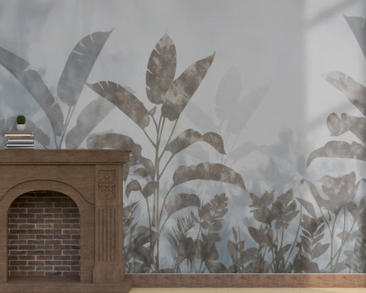 A high-resolution detail of the Silver Mist Tropical Wallpaper, showcasing the layered, semi-translucent textures of the large tropical leaves. The image highlights the painterly, watercolor-style gradients and the sophisticated slate and silver gray tones that define this nature-inspired mural.