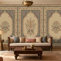 Vanamala Garden Mural Wallpaper - Slate Blue showcasing ornate peacock motifs, intricate floral medallions, and decorative heritage borders in dusky teal blue and ivory tones, styled in a luxurious traditional living room with carved wooden furniture, soft furnishings, and warm natural lighting.