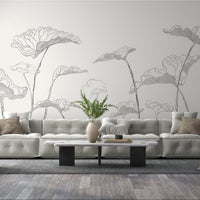 Graphite leaf pattern mural wallpaper installed as a feature wall in living room, dining room, and bedroom interiors with botanical detailing.