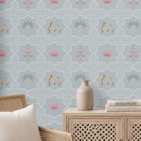 Close-up view of the Vraj Kamal wallpaper showcasing the intricate geometric damask lattice pattern, detailed white Pichwai cows, and delicate pink lotus flower motifs on a soft powder blue background.