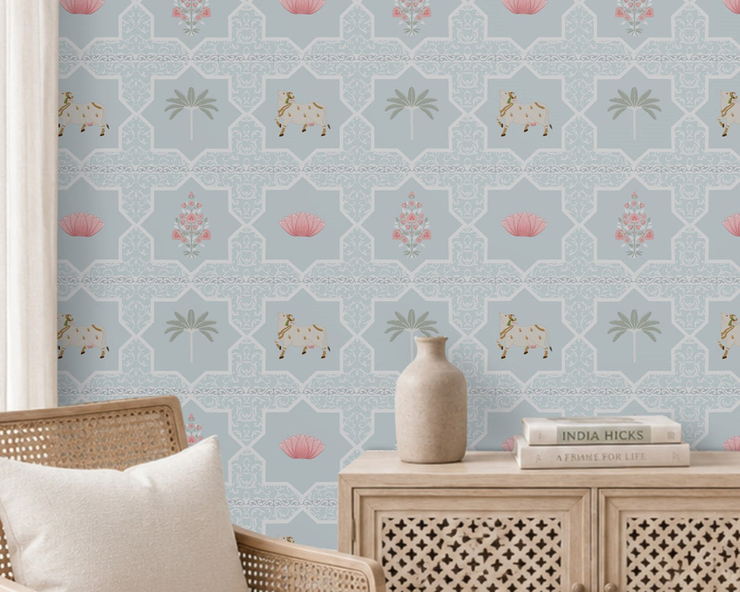 Close-up view of the Vraj Kamal wallpaper showcasing the intricate geometric damask lattice pattern, detailed white Pichwai cows, and delicate pink lotus flower motifs on a soft powder blue background.
