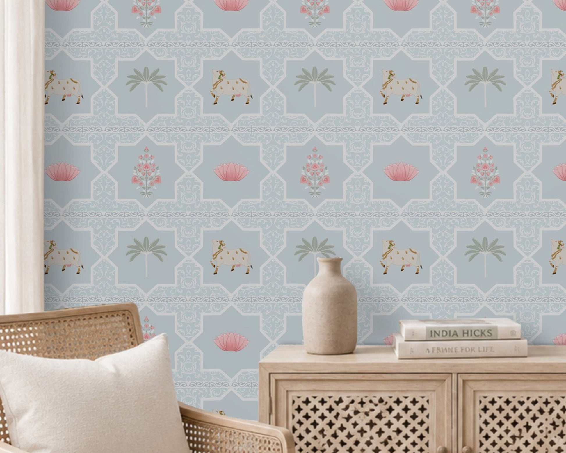 Close-up view of the Vraj Kamal wallpaper showcasing the intricate geometric damask lattice pattern, detailed white Pichwai cows, and delicate pink lotus flower motifs on a soft powder blue background.