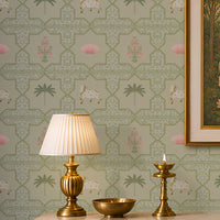 Close-up view of the Vraj Kamal wallpaper showcasing the intricate geometric damask lattice pattern, detailed white Pichwai cows, and delicate pink lotus flower motifs on a soft mint green background.
