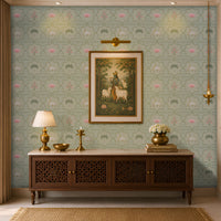 A luxurious Indian-style living room or pooja room foyer featuring a sage green Vraj Kamal Pichwai wallpaper patterned with cows and pink lotuses, styled with a wooden console table, a traditional Lord Krishna painting, and gold accents.