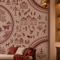 Warli Divine Harmony - Dusty Rose Pink Elegant Warli art seamless wallpaper in soft blush beige and terracotta red, featuring intricate tribal illustrations of village life, dancers, trees, huts, animals, and a central Radha Krishna-inspired motif, styled in a luxurious Indian living room with carved wooden furniture and warm ambient lighting.