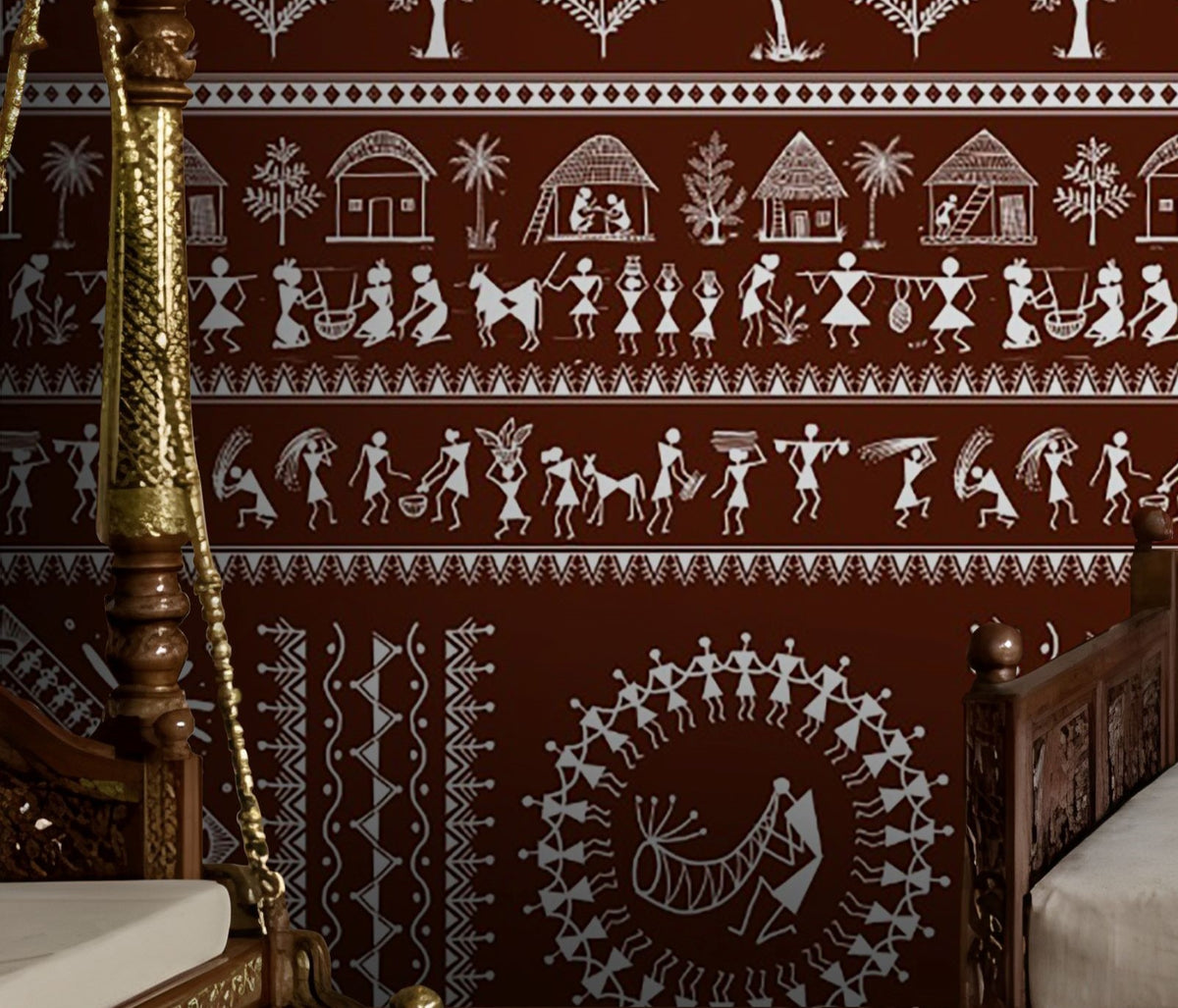 A traditional Indian living room titled “Warli Folk Tales – Vintage Reddish Brown.” The focal wall is painted in a deep reddish-brown shade and decorated with intricate white Warli tribal art depicting village life, including dancing figures, farming scenes, animals, trees, and geometric motifs. A carved wooden daybed with patterned cushions and a brown throw blanket sits against the wall, accompanied by a clay pot on the floor and a woven rug with geometric designs. The warm, earthy palette and handcrafted
