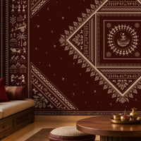 A large wall tapestry with an intricate geometric and tribal pattern in deep maroon and cream, displayed in a styled living room setting with a wooden coffee table, poufs, and a daybed.