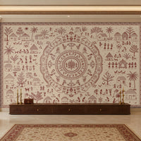 A large wall mural featuring an intricate circular mandala and traditional folk art motifs in muted red-brown on a warm cream background, displayed in a grand, elegant room with a matching patterned rug and dark wood furniture.