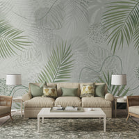An architectural perspective of a contemporary living room featuring the Whispering Palms Mural as a full-scale feature wall. The mural’s soft green tones pair elegantly with a beige fabric sofa, rattan accent chairs, and a traditional patterned rug, creating a serene and balanced interior sanctuary.