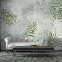 An architectural perspective of a contemporary living room featuring the Whispering Palms Mural as a full-scale feature wall. The mural’s soft green tones pair elegantly with a beige fabric sofa, rattan accent chairs, and a traditional patterned rug, creating a serene and balanced interior sanctuary.