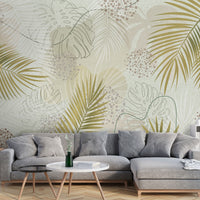 An architectural perspective of a contemporary living room featuring the Whispering Palms Mural in Tea Green as a full-scale feature wall. The mural’s light green and neutral gray tones pair elegantly with a cream-colored fabric sofa, light oak furniture, and minimalist decor, creating a serene and balanced interior sanctuary.