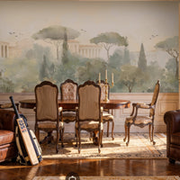 An architectural perspective of a grand traditional dining room featuring the Whispers of Rome Floral Mural as a full-scale panoramic backdrop. The mural’s soft, atmospheric colors create a sophisticated "framed view" that pairs perfectly with classic leather chesterfield seating, antique wooden furniture, and ornate wainscoting.