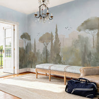An architectural perspective of a grand traditional dining room featuring the Whispers of Rome Mural in Sky Blue as a full-scale panoramic backdrop. The mural’s soft, atmospheric colors create a sophisticated "framed view" that pairs perfectly with classic leather chesterfield seating, antique wooden furniture, and light-filled interiors.