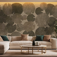 An architectural perspective of a modern luxury living room featuring the Whispers of the Pond Mural as a full-scale feature wall behind a large cream sectional sofa. The mural’s rhythmic, circular patterns create a sense of organic movement and tranquility, pairing perfectly with gold accents, velvet upholstery, and warm ambient lighting.