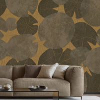 A high-resolution detail of the Whispers of the Pond Nature Wallpaper, showcasing the intricate, lace-like skeletal structures and detailed veining of the overlapping lily pads. The image highlights the sophisticated interplay between the golden-hued leaf patterns and the warm, textured beige background.