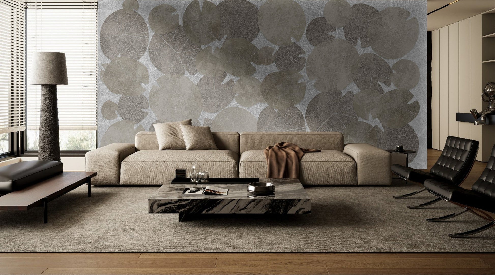 An architectural perspective of a modern luxury living room featuring the Whispers of the Pond Mural in Silver as a full-scale feature wall behind a large sectional sofa. The mural’s rhythmic, circular patterns create a sense of organic movement and tranquility, pairing perfectly with chrome or silver accents, minimalist furniture, and cool ambient lighting.