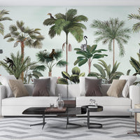 An architectural perspective of a contemporary living space featuring the Wild Wonderlands Mural in Porcelain Mint as a full-scale feature wall. The mural’s expansive botanical and wildlife vista pairs elegantly with light wood furniture and neutral textiles, creating a lively and cultured interior sanctuary.