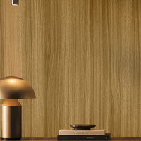 Warm honey brown seamless wood texture wallpaper with fine vertical grain in a modern interior. 