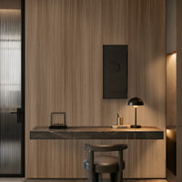  A modern interior design rendering of a kitchen bar area featuring wooden wall and floor textures, a central stone-finished island with two bar stools, and a decorative rectangular wall panel behind the counter. Soft ambient lighting highlights the materials and layout, creating a warm, contemporary atmosphere.