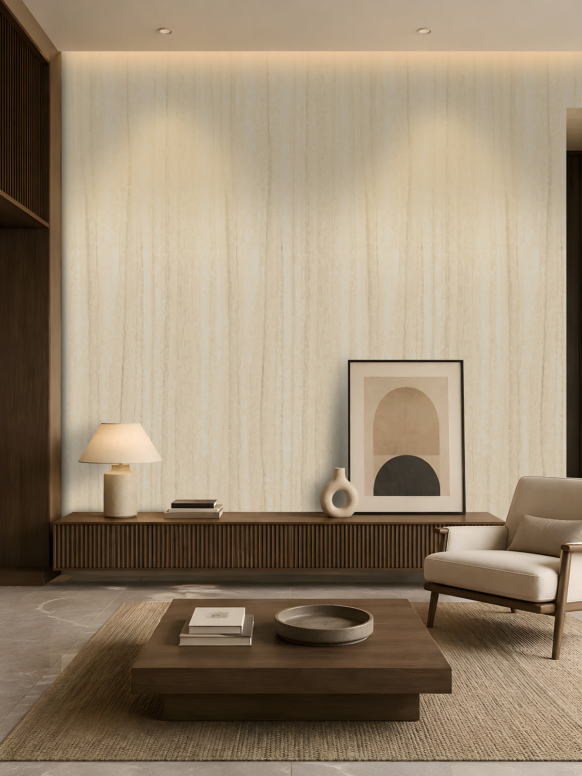 Wood Seamless Wallpaper - Desert Ivory featured in a modern minimalist living room. The wallpaper showcases a soft almond beige tone with subtle vertical wood grain texture, creating a warm and elegant backdrop. Paired with dark wood furniture, neutral décor, ambient lighting, and contemporary accents, the design adds natural warmth, depth, and sophistication to the interior space.