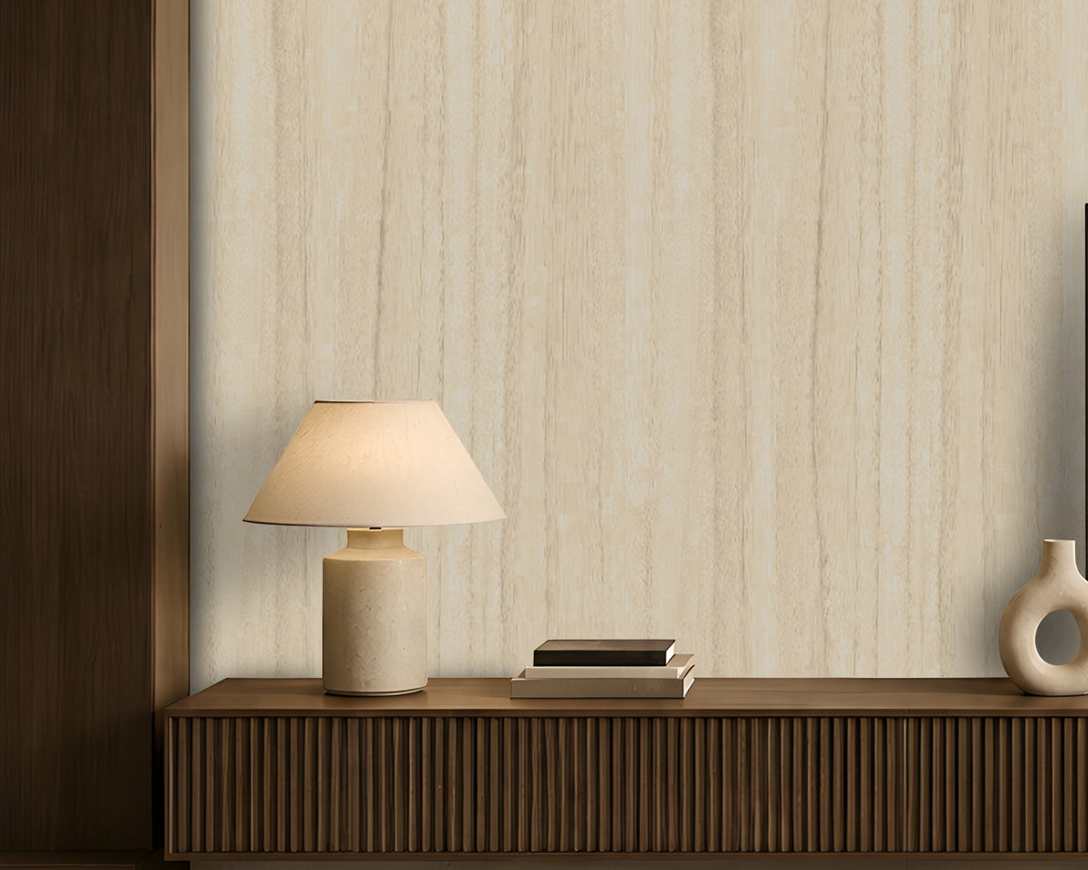Wood Seamless Wallpaper - Desert Ivory featured in a modern minimalist living room. The wallpaper showcases a soft almond beige tone with subtle vertical wood grain texture, creating a warm and elegant backdrop. Paired with dark wood furniture, neutral décor, ambient lighting, and contemporary accents, the design adds natural warmth, depth, and sophistication to the interior space.