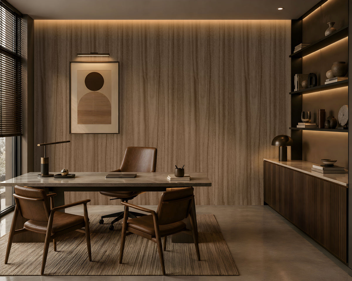 Wood Seamless Wallpaper - Espresso Brown displayed in a contemporary home office featuring a warm almond-beige wood grain texture with seamless vertical patterns. The wallpaper creates a sophisticated backdrop for dark wood shelving, leather seating, modern artwork, and ambient lighting, adding natural warmth, depth, and elegance to the workspace.